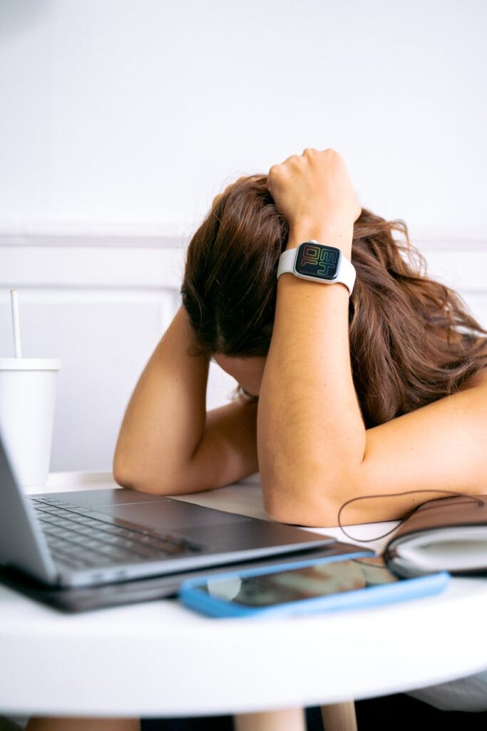 a woman holding her head